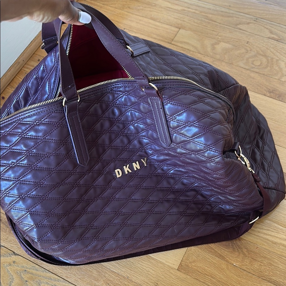 DKNY Purple Quilted Travel Bag with Glossy Finish
Pair with matching backpack.